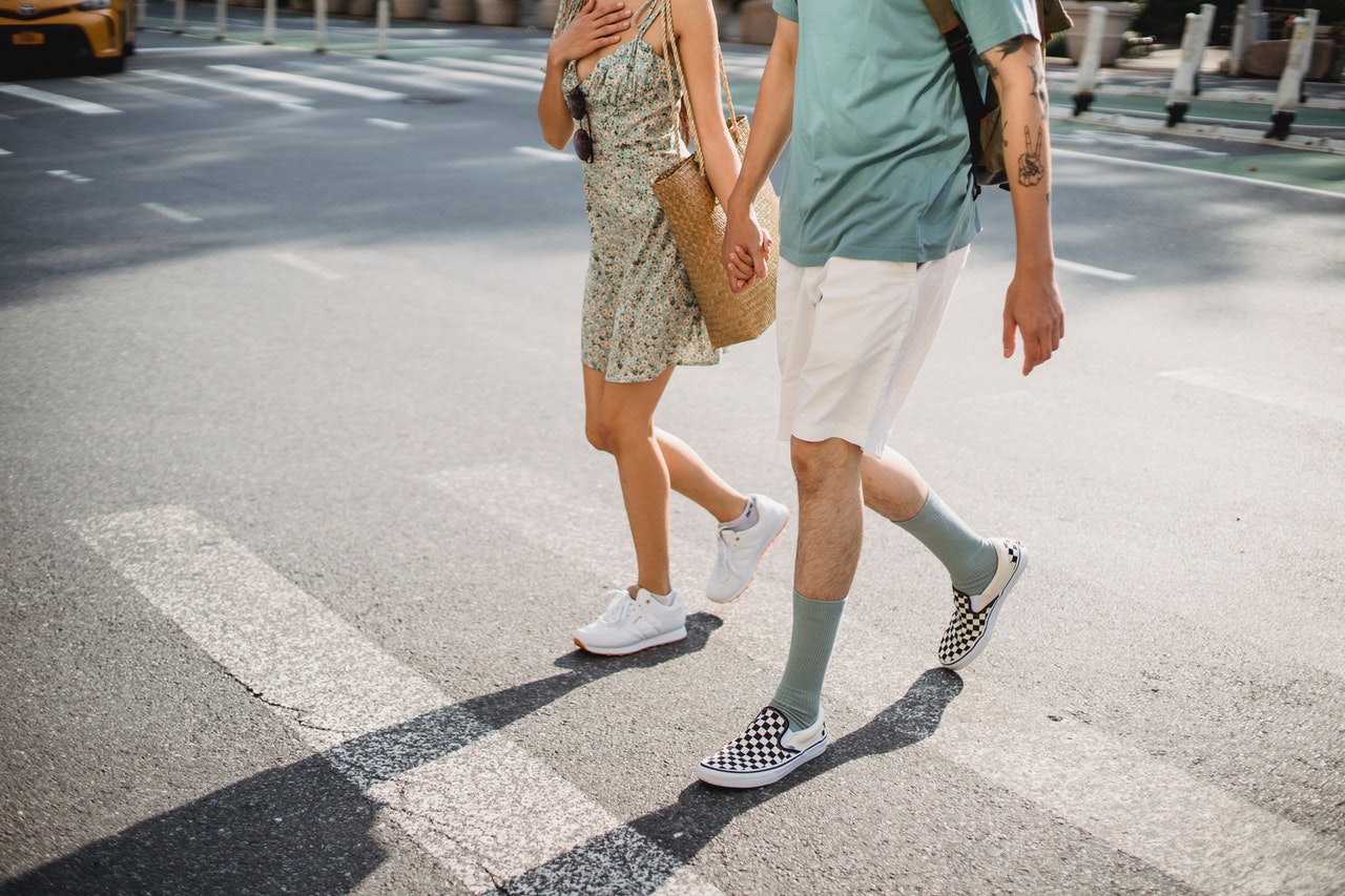 couple crossing on crosswalk