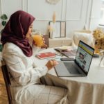 Woman in Hijab using a Laptop for online dating