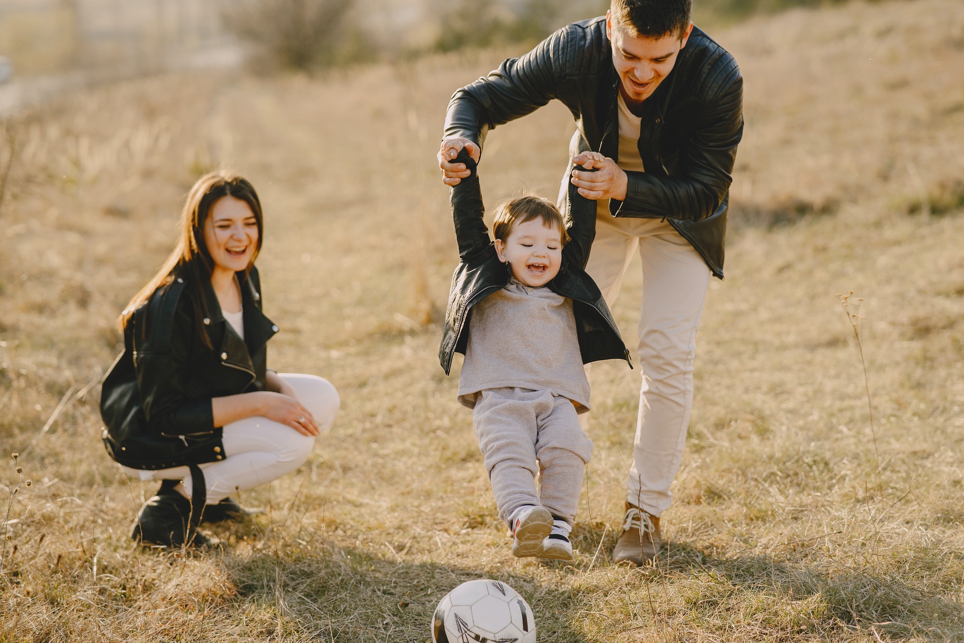 a family has fun with soccer ball