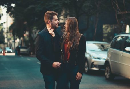 Romantic modern young couple bonding on street