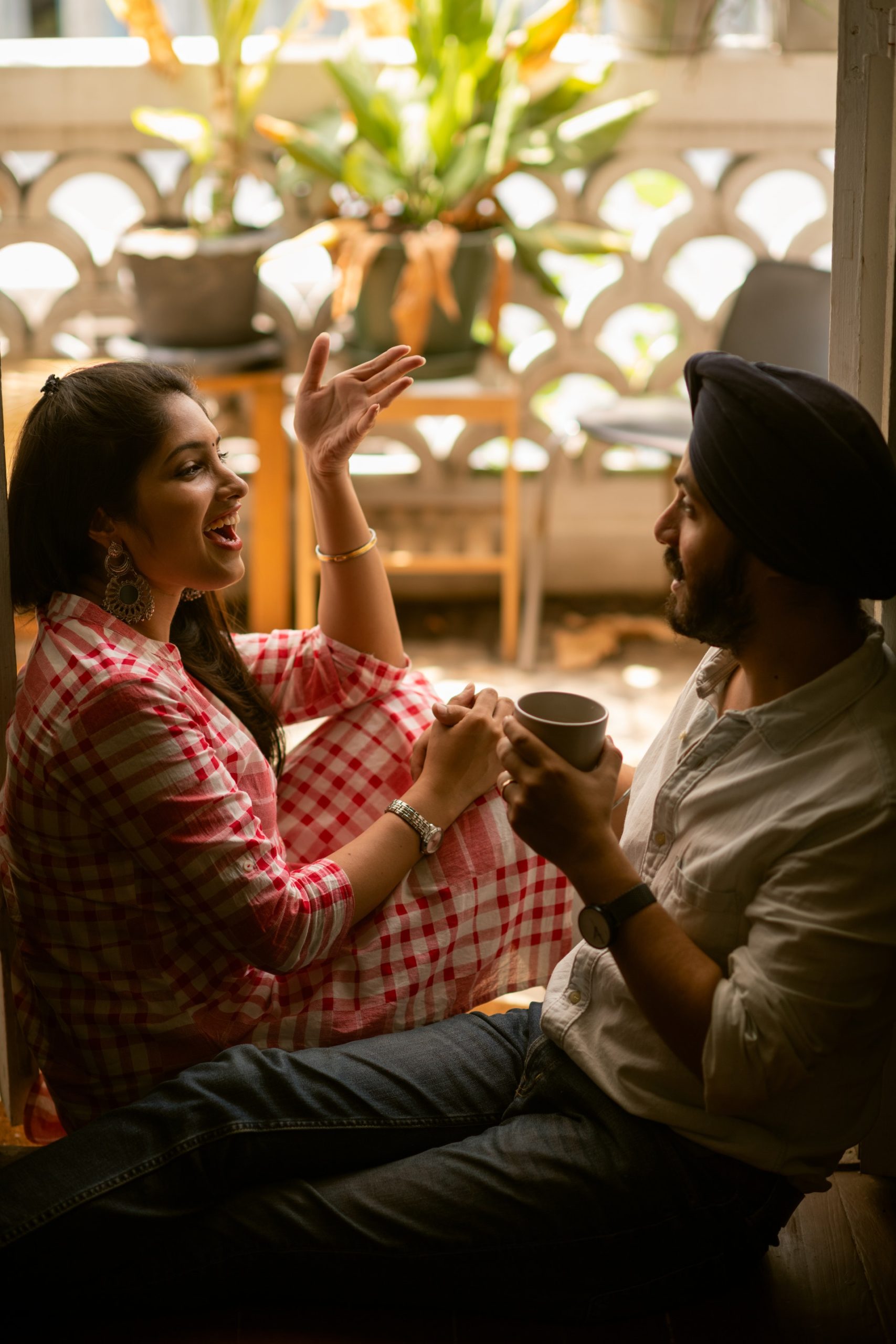 young Indian couple talking happily to each other