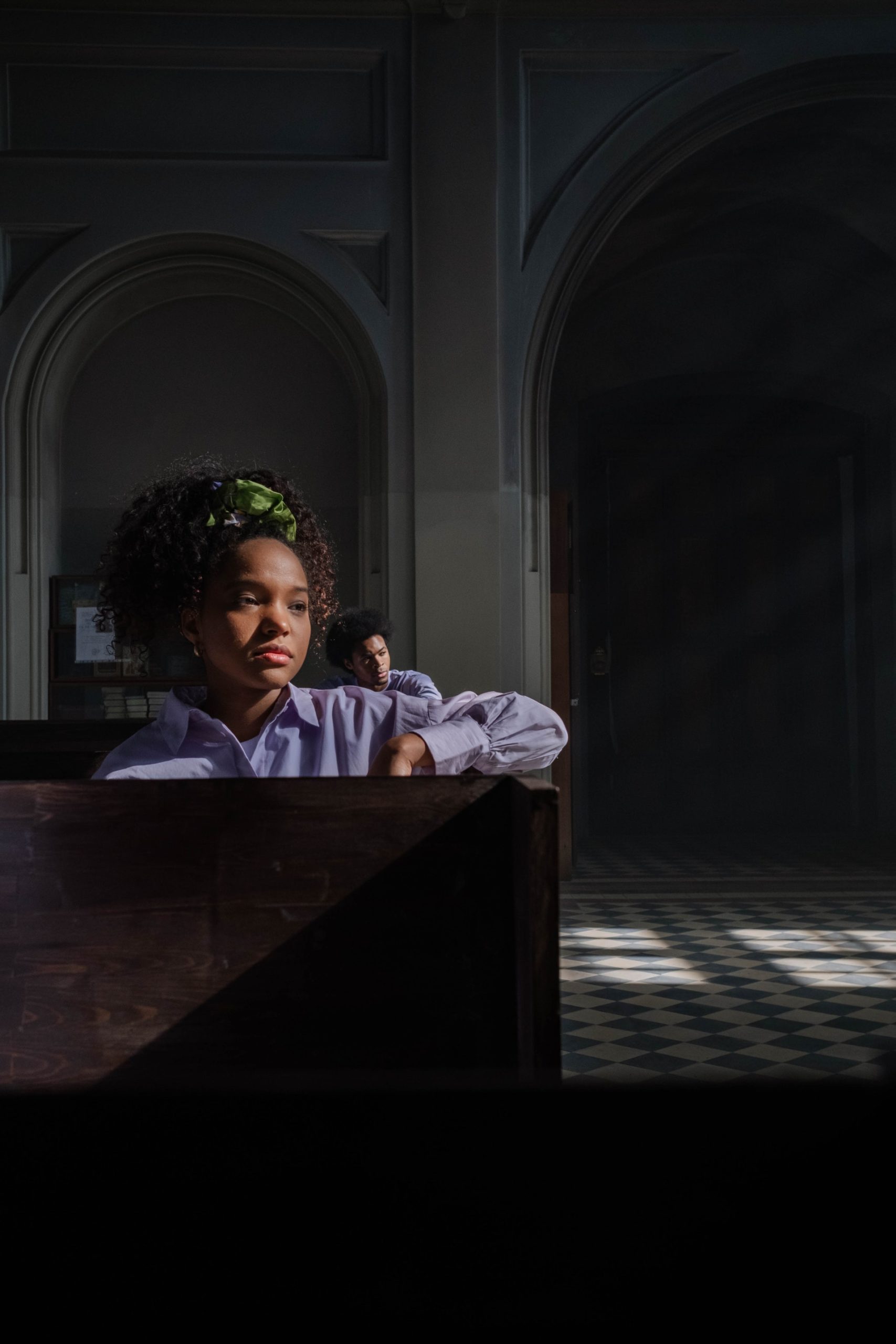 a woman sitting inside a church