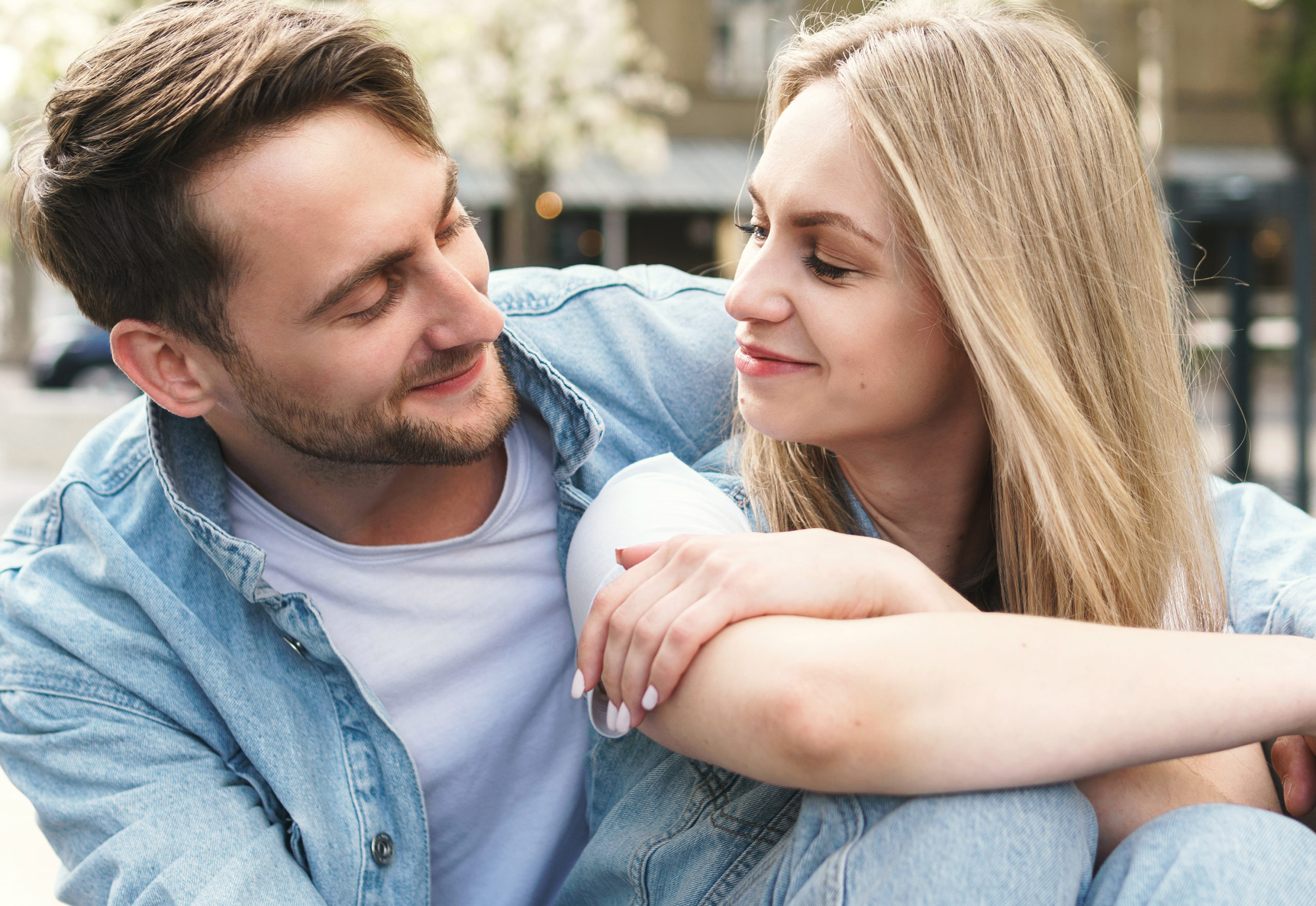 Portrait of young and sensual couple during a date outdoors