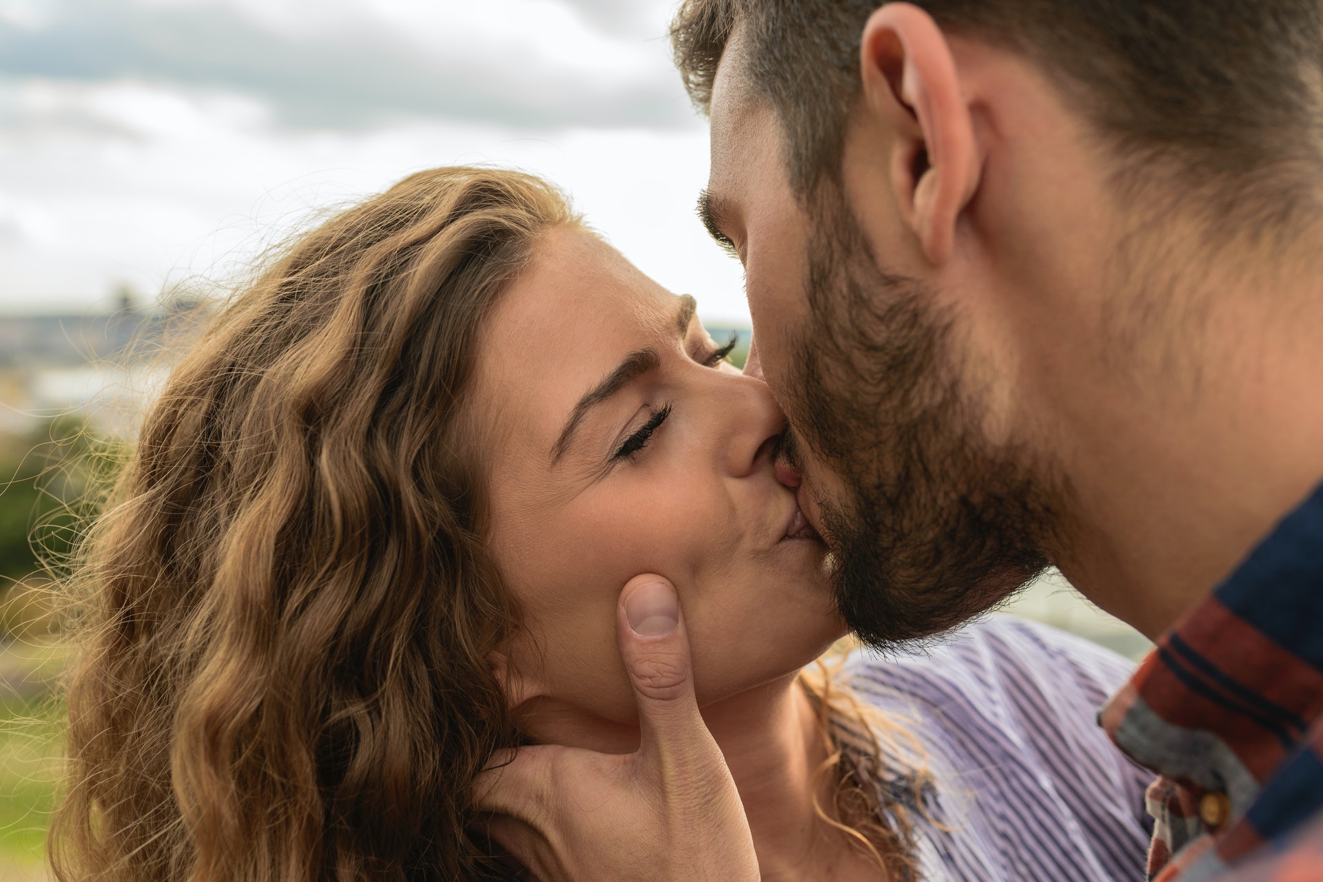 a man kissing a woman as it's how men show love