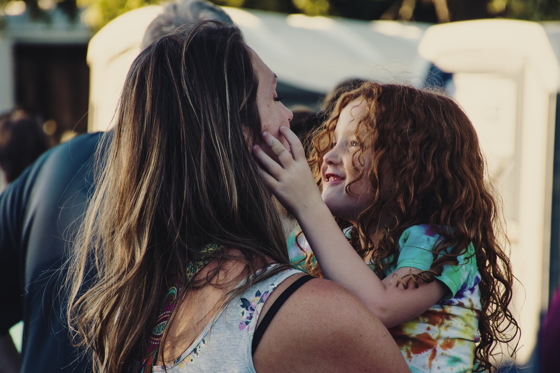 a woman talking to her daughter